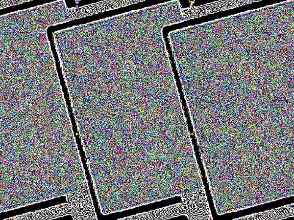 The same image reduced to its least-significant-bit plane: dense noise filling the three cards